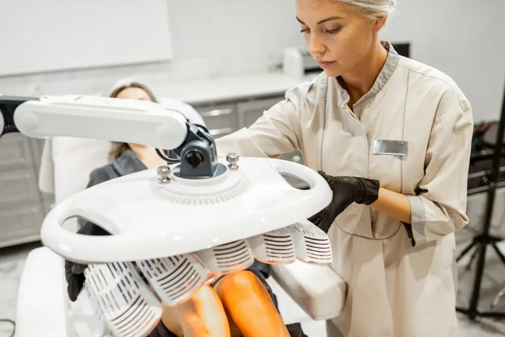 Clinician operating advanced laser therapy device